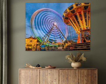 Ferris wheel at the folk festival in the evening by Animaflora PicsStock