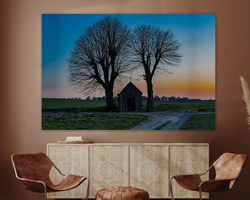 chapel in the middle of the meadow during a colorful sunset by Kim Willems