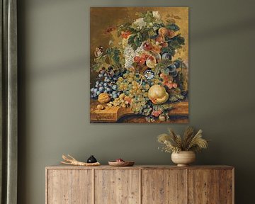 Een stilleven met een mand fruit, noten en bloemen op een stenen richel, Jacobus Linthorst