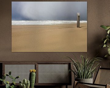 Beach post in drifting sand with hailstorm by Menno van Duijn