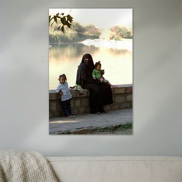 Veiled woman with children