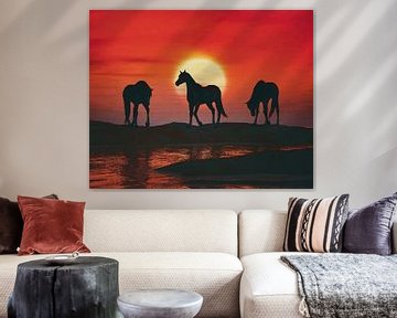 Paarden bij rode zonsondergang