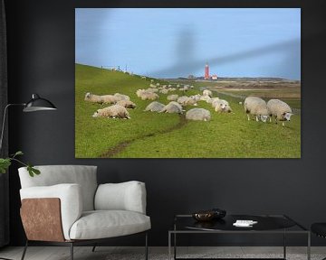 Sheep on dike in front of red lighthouse Texel by My Footprints