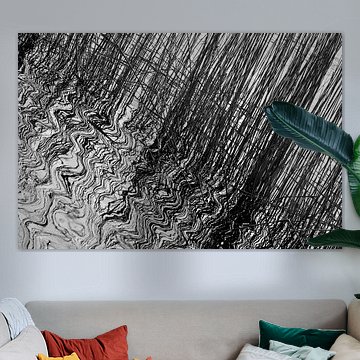 Reed, reflected in the moving water