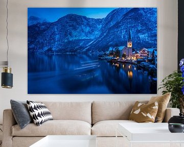 Hallstatt at night with lights of a small ferry by Sonja Birkelbach