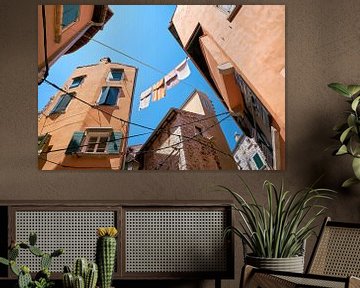 Laundry lines with clothes in the alleys of the old town of Rovinj by Heiko Kueverling