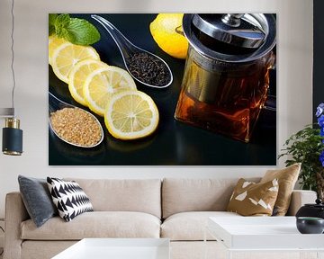 Black tea served with lemon slices, sugar and teapot by Babetts Bildergalerie