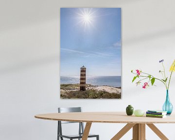 Lighthouse in the dunes near Dishoek under the bright sun by John van de Gazelle