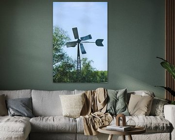 Een windmolen op een zonnige dag van Jurjen Jan Snikkenburg