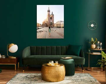 Woman walking across the Grand Market (Rynek Główny) of the Polish city of Krakow by OCEANVOLTA