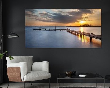 Jetty in Lake Leekster during sunset by Martijn van Dellen