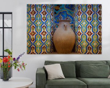 Pottery jug in niche with mosaic tiles