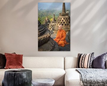 Buddhist monk in orange robe meditates on Borobudur at sunrise by Jeroen Langeveld, MrLangeveldPhoto