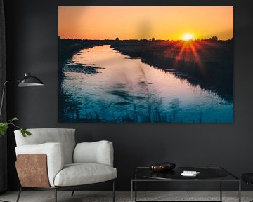 Zonsondergang in de polder van Henri van den Berg