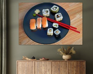 Sushi arranged on a plate with chopsticks by Babetts Bildergalerie