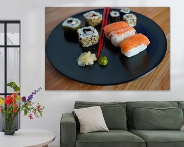 Sushi arranged on a plate with chopsticks by Babetts Bildergalerie