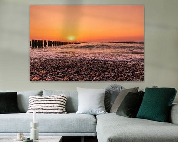 Sunset Domburg with shells and breakwaters by Rick van de Kraats