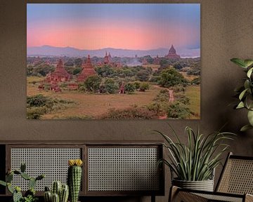 Ancient pagodas in the landscape of Bagan in Myanmar with sunset by Eye on You