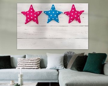 Fabric stars on white background with copy space by Alex Winter