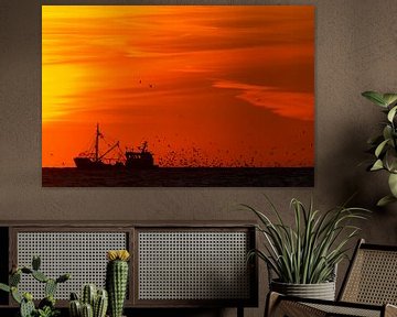 Fishing boat at sunset with seagulls by Menno van Duijn