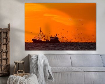 Fishing boat at sunset with seagulls by Menno van Duijn