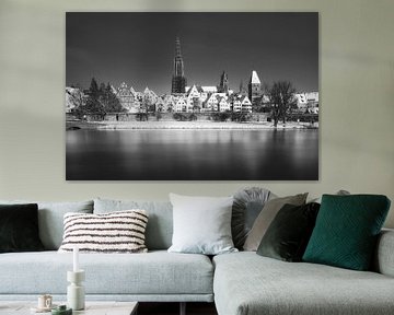 Black and white panorama of the city of Ulm in winter with snow, river Danube and Ulm Cathedral