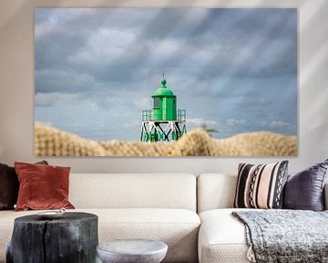 The green beacon of Stavoren with a detail of a fishing net in the foreground. by Henk Van Nunen Fotografie