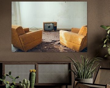 old sofa armchairs with a cathode ray tube television set by Denny Gruner