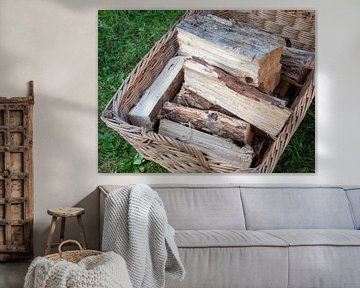 Firewood for the fireplace in a basket by Animaflora PicsStock