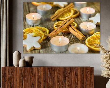 Christmas candles, cookies and spices decoration on wood by Alex Winter