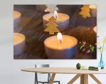 Advent or Christmas candlelight with ornaments on wood by Alex Winter