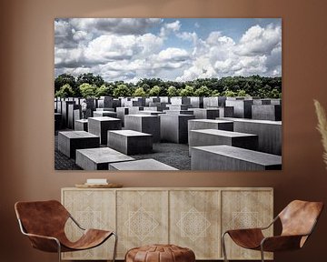 holocaust memorial in berlin the big stones with trees and beautiful sky by Eric van Nieuwland