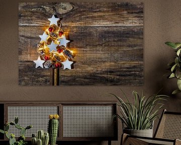 Christmas tree decoration with red baubles, white star shapes and pine cones by Alex Winter