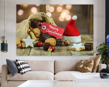 Kerstmis voedsel en snoepjes met tag Merry Christmas en fonkelende lichten achtergrond van Alex Winter