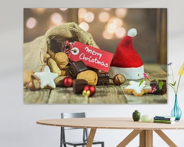 Christmas food and sweets with tag Merry Christmas and sparkling lights background by Alex Winter