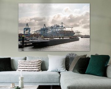Shipping container terminal in the port of Rotterdam with a barge in the foreground by Sjoerd van der Wal Photography