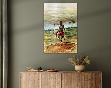 Maasai warrior standing on a hill looking at the horizon