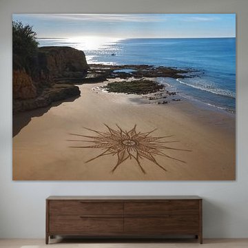 Mandala auf einem Strand am Meer