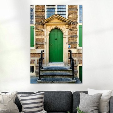 Rembrandt Museum house facade with entrance door in Amsterdam city center in Netherlands