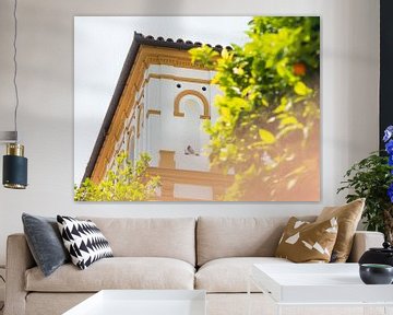 Colorful house and orange trees in Barrio Santa Cruz, Seville | Travel Photography Spain by Teun Janssen