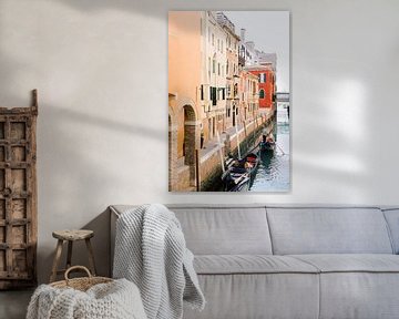 Venice | Gondola between orange, yellow and red houses by Milou van Ham