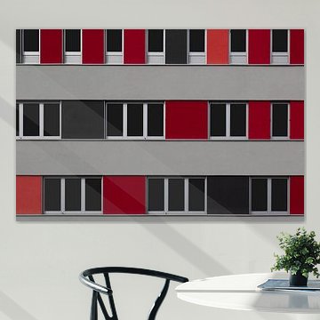 Fassade eines modernen Gebäudes in grau und rot von Joachim Küster
