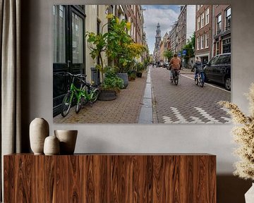 Fietsend naar de Westerkerk in Amsterdam van Peter Bartelings