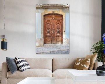 Brown wooden double door in Alfama, Lisbon, Portugal by Christa Stroo photography