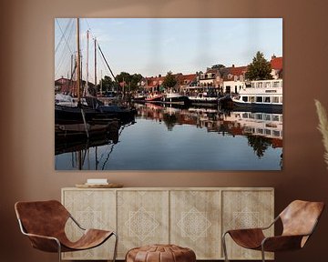 Elburg Marina in the evening with boats and reflections by Marianne van der Zee