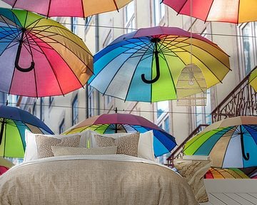 Rainbow umbrellas on Pink street in Lisbon, Portugal by Christa Stroo photography