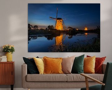 The illuminated windmills of Kinderdijk by Raoul Baart