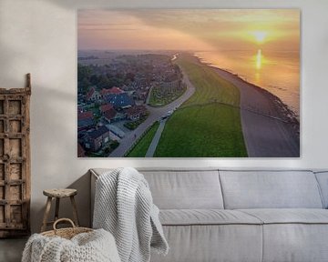 Luchtfoto van het plaatsje Wierum aan de Waddenzee in Friesland bij zonsondergang van Eye on You