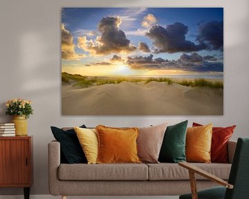 Sunset at the beach of Texel with sand dunes in the foreground