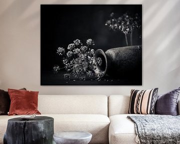 Dried flowers, dried hogweed with lying vase.